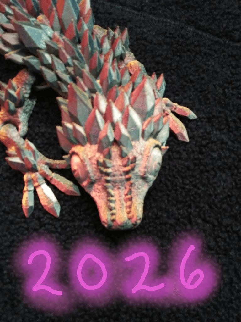 A spikey dragon looks down at the number 2026.